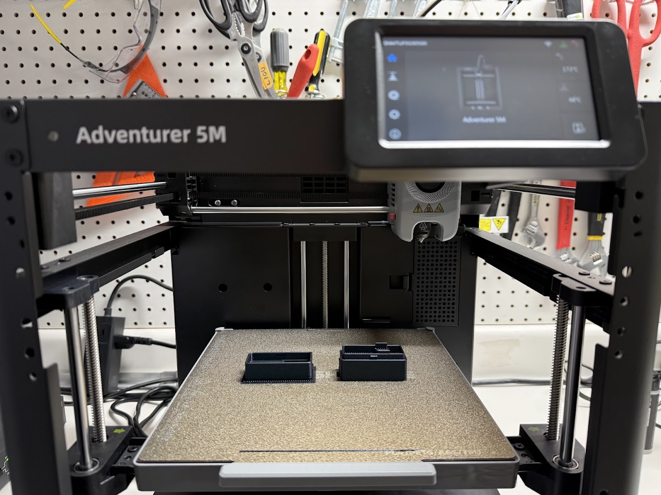 Flashforge Adventurer 5M 3D printer with MOTIONSENSR enclosure bases on the print bed