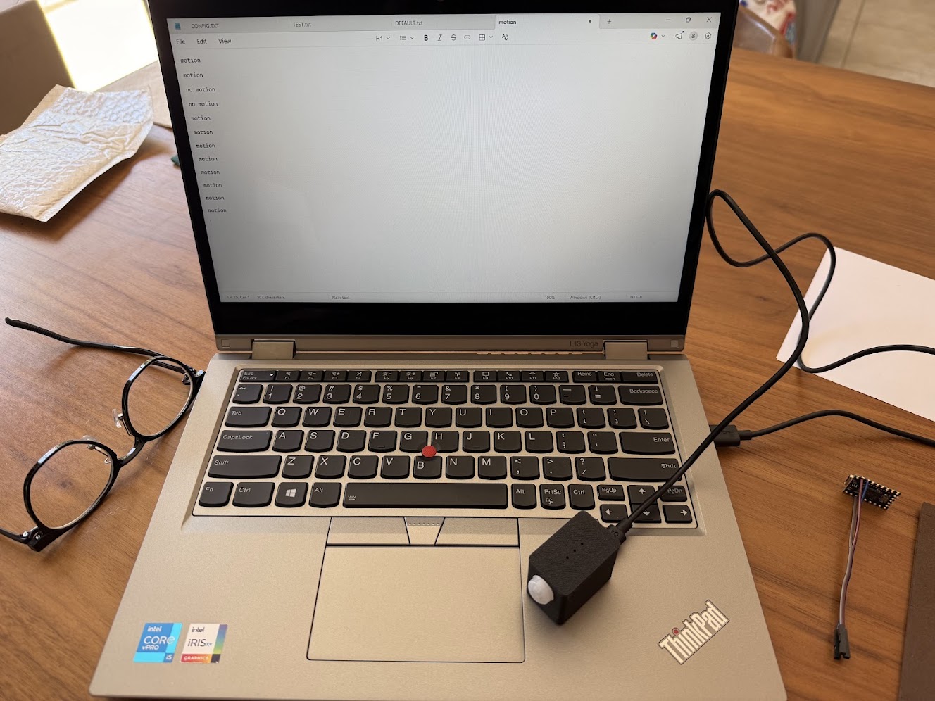 Testing completed MOTIONSENSR units plugged into a laptop on a workbench